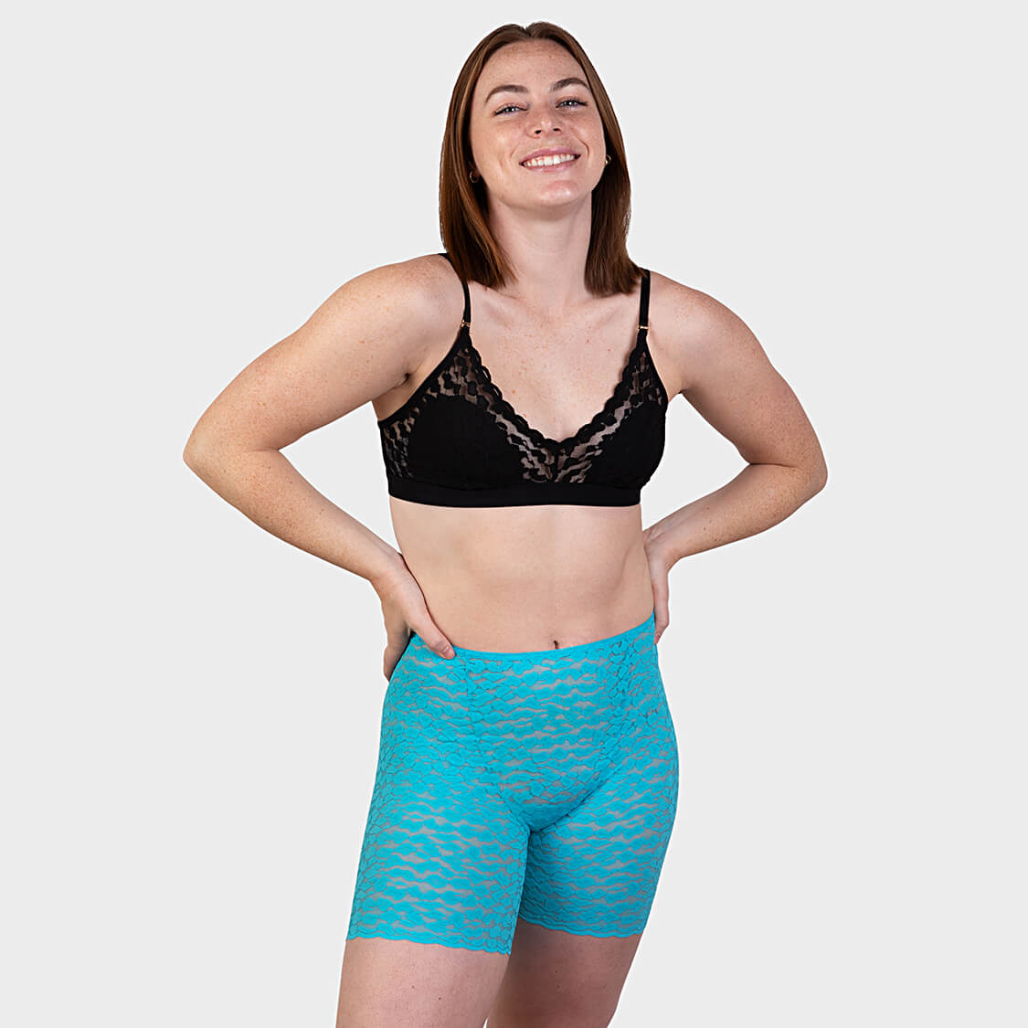 Turquoise lace slip shorts and black lace bralette
